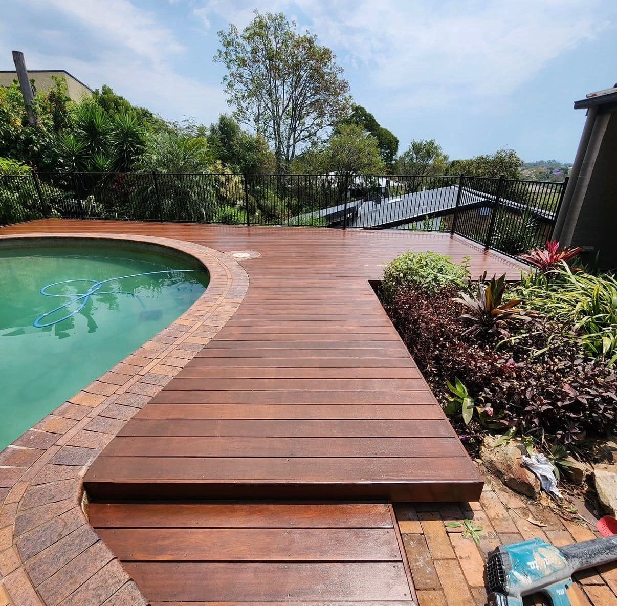Timber decking alongside swimming pool